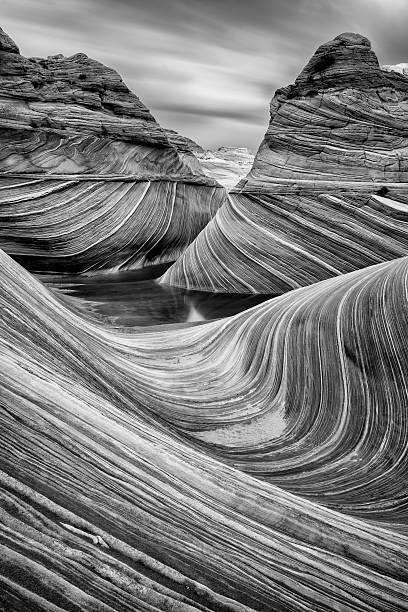 The Wave in Black and White A long exposure of the Wave in Coyote Buttes North, Arizona. desert area photos stock pictures, royalty-free photos & images
