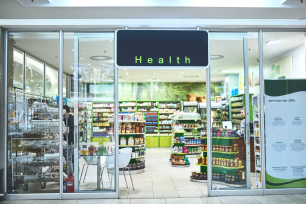 The wellness store welcomes you Shot of the entrance to a health store building entrance stock pictures, royalty-free photos & images