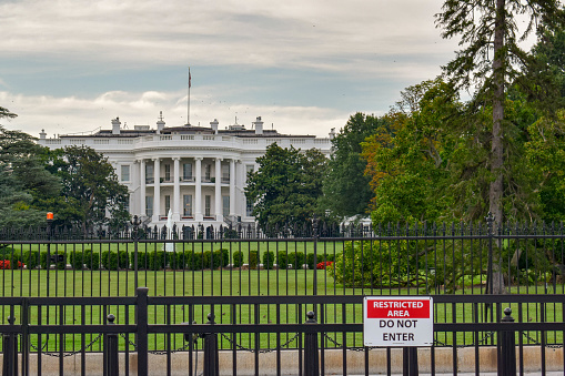Photo of the White House in Washington, D.C. on a cloudy day with a \