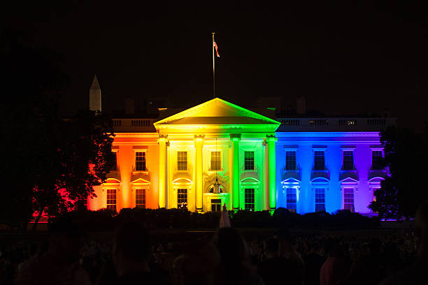 The White House Lit in Rainbow Colors The White House is lit up in rainbow colors to celebrate the Supreme Court's opinion legalizing gay marriage in all fifty states  white house stock pictures, royalty-free photos & images