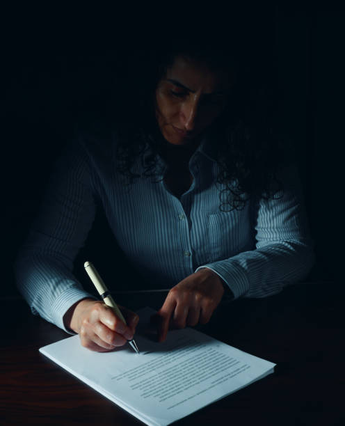 The woman who signed the agreement, Signing a divorce. stock photo