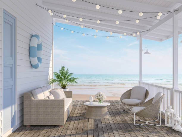 The wooden house terrace on the beach 3d render The wooden house terrace on the beach 3d render,Tthere has old wooden floors,white plank walls,blue doors decorated with fabric and rattan furniture, decorated with string lights, overlooking the sea. cottage stock pictures, royalty-free photos & images