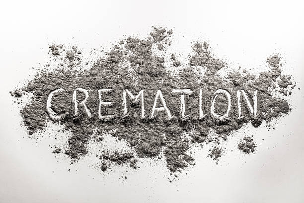 The word cremation written in ash The word cremation written in grey dead body ash cremation stock pictures, royalty-free photos & images