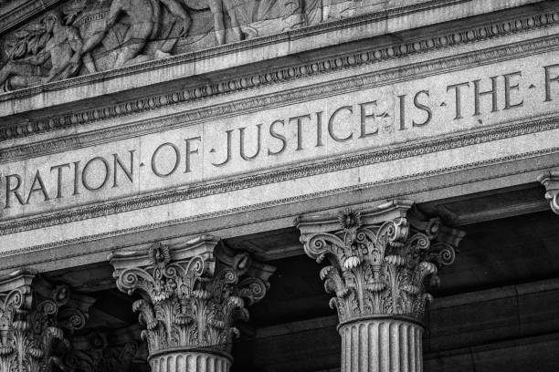 The Word Justice on a Neoclassical American Building Facade Courthouse, Manhattan, New York City, USA supreme court justices stock pictures, royalty-free photos & images
