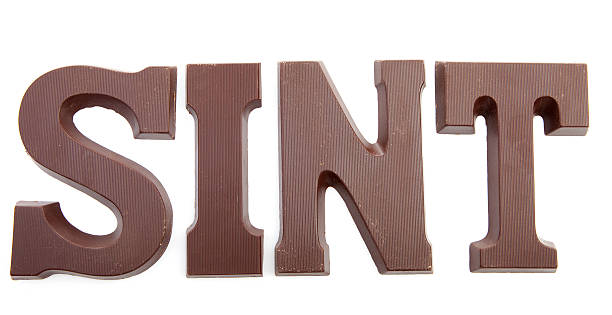 the word "sint" in chocolate letters - chocoladeletter stockfoto's en -beelden