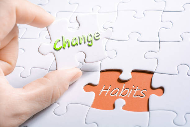 the words change and habits in missing piece jigsaw puzzle - change habits imagens e fotografias de stock
