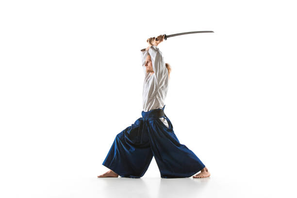 the young man are training aikido at studio - samurai sword stock pictures, royalty-free photos & images