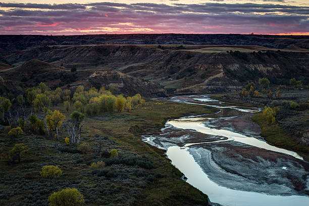 Theodore Roosevelt National Park Sunset over the Little Missouri River from the Wind Canyon Overlook at Teddy Roosevelt National Park theodore roosevelt national park stock pictures, royalty-free photos & images