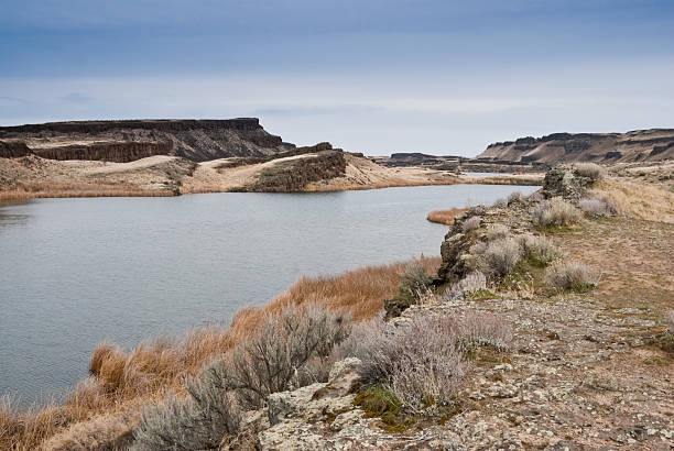 Corral Lake in the Eastern Washington Potholes There are many pothole lakes and ponds in the scablands of Central Washington. Corral Lake is in the Columbia National Wildlife Refuge near Othello, Washington State, USA. jeff goulden washington state desert stock pictures, royalty-free photos & images
