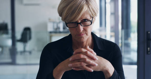 There's no place for mediocre in this business Portrait of a mature businesswoman in an office judgement stock pictures, royalty-free photos & images