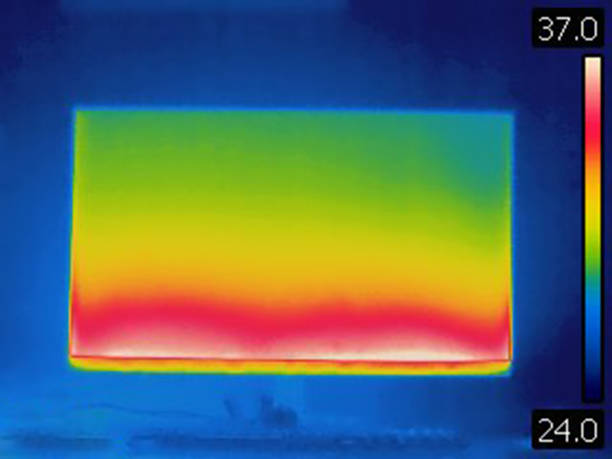 Thermal infra red image of heat emission of computer lcd monitor Image taken with infra red camera. Each color represents different temperatures, as is shown on spectrum scale on right side of image. infrared stock pictures, royalty-free photos & images