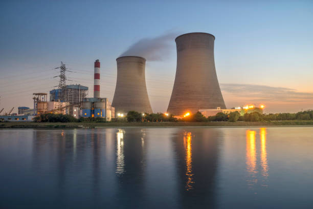 Thermal power plant stack at night stock photo