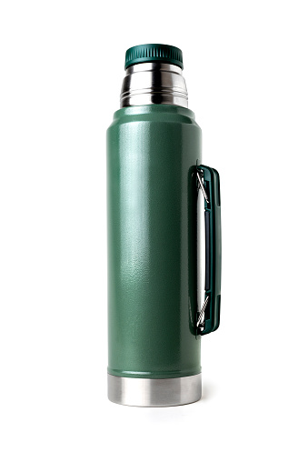 Green vacuum insulated bottle, isolated on a white background with clipping path.