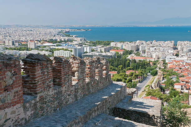 Thessalonika with old city wall "Thessalonika, the second largest city of greece. In front the old city wall, in the background the aegean sea and mount olympus" mount olympus stock pictures, royalty-free photos & images