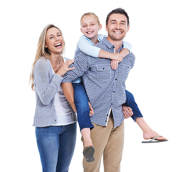 Studio shot of a laughing mother, daughter and father against a white background