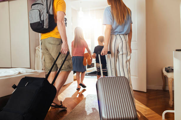 They don’t travel light Shot of a happy family leaving their home for a vacation leaving stock pictures, royalty-free photos & images