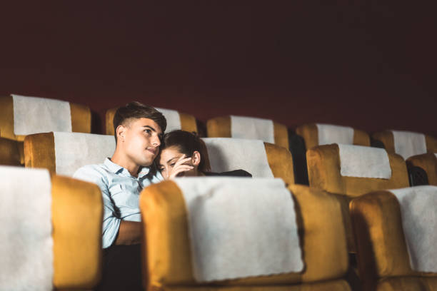 They is watching a movie has sad and cry expression. stock photo