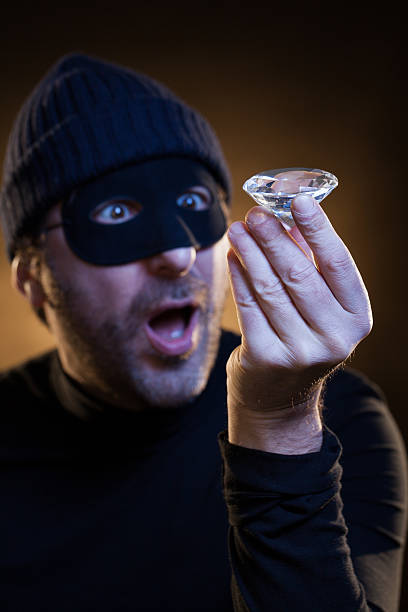 Thief Astonished by His Just Stolen Big Diamond stock photo