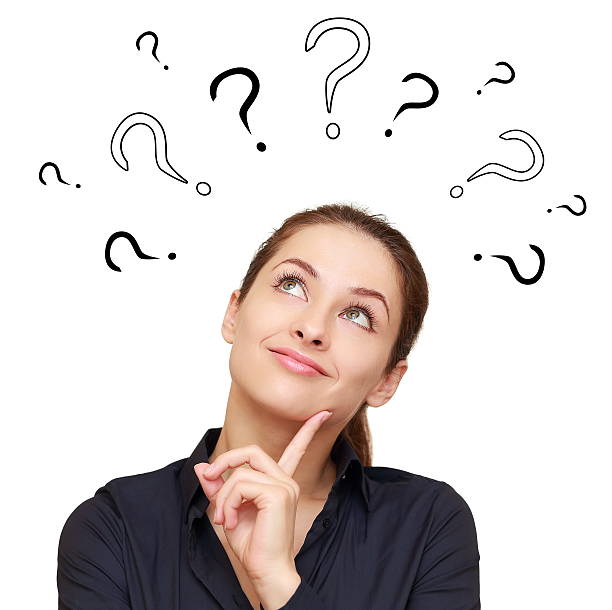 Thinking smiling woman with questions mark above stock photo