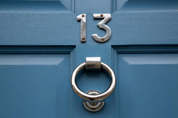 Thirteen Number on Blue Door stock photo
