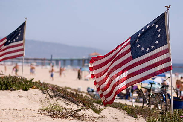 Thirteen-star American flags, fly at the beach stock photo