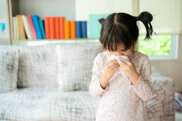 This child is allergic to air or is infected with influenza virus stock photo