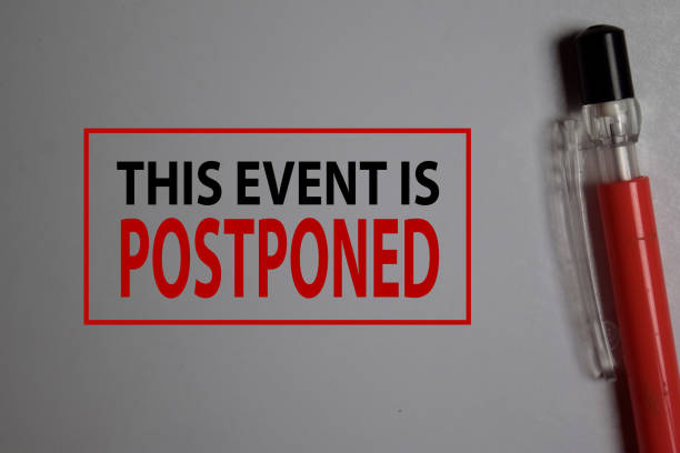 This Event is Postponed write on a book isolated on Office Desk. This Event is Postponed write on a book isolated on Office Desk. postponed stock pictures, royalty-free photos & images