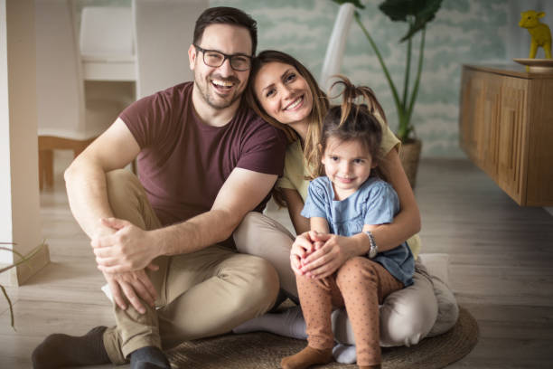 This is our time. This is our time. Parents with daughter at home. white people photos stock pictures, royalty-free photos & images