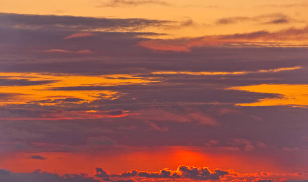 Red Sunset Background This red sunset background was photographed over the Pacific Ocean in Rockaway Beach, Oregon, USA. jeff goulden sunset stock pictures, royalty-free photos & images