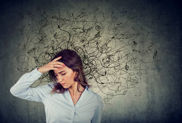 Thoughtful stressed woman with a mess in her head stock photo