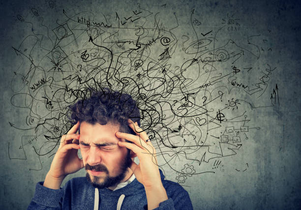 Thoughtful stressed young man with a mess in his head stock photo