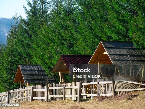 istock Three alcoves surrounded by pine trees. 899632618