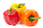 istock Three bell peppers, a red, a yellow and an orange one 157568993