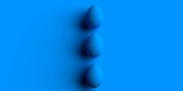 Three blue Easter Eggs on tone-to-tone background with large blank space for add text stock photo