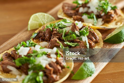 istock three carne asada mexican street tacos in corn tortilla with lime 1272532786