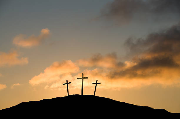 Three Crosses on Good Friday The Crucifixion at Calvary (Golgotha) near Jerusalem on Good Friday. Some copy space in the sunset. good friday stock pictures, royalty-free photos & images