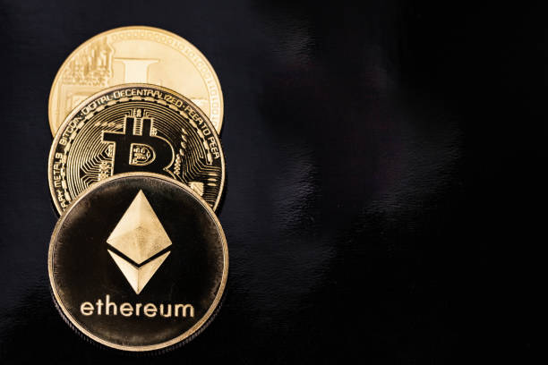 Three Cryptocurrency Coins with Ethereum in Foreground Everett, WA - USA - 09-28-2021: Crypto Currency Coins with Ethereum  in Foreground  With Ethereum  stock pictures, royalty-free photos & images