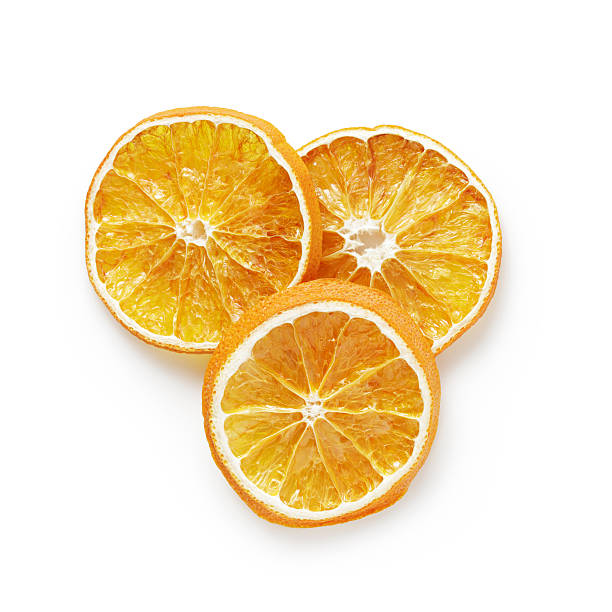 three dried orange slices from above three dried orange slices from above, on white background dried food photos stock pictures, royalty-free photos & images