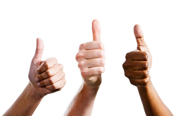 Three female hands give joint thumbs up stock photo