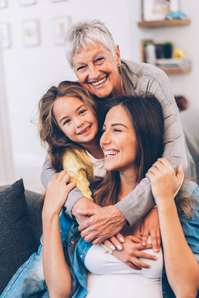 three generation women - grandparents vertical imagens e fotografias de stock