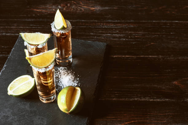 three glasses of tequila stock photo