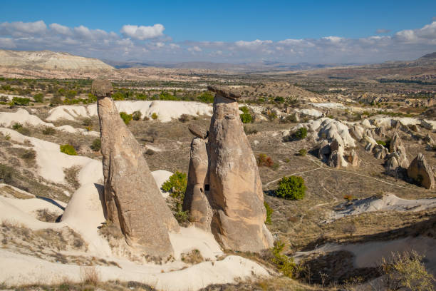 Three graces or three beauties fairy chimneys in Cappadocia, Turkey. Three graces or three beauties fairy chimneys in Cappadocia, Turkey. Three graces are one of the most popular places for tourists in Cappadocia. asian beauties stock pictures, royalty-free photos & images