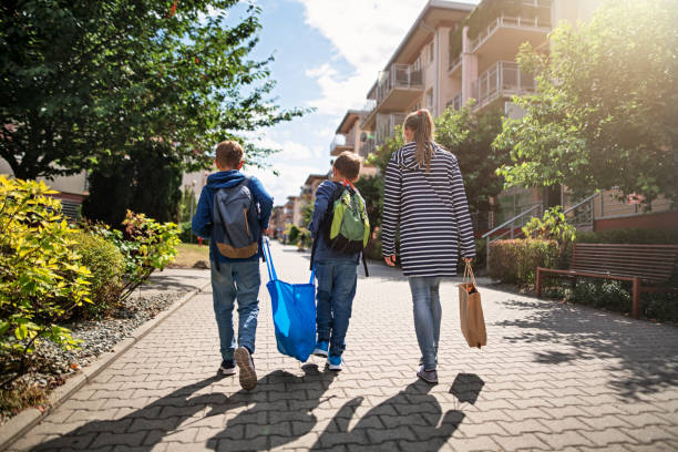 Three kids carrying shopping home in resusable shopping bags Three kids carrying shopping home in resusable shopping bags.
Nikon D850 carrying stock pictures, royalty-free photos & images