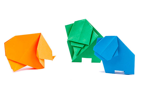 Three origami elephants - white background stock photo