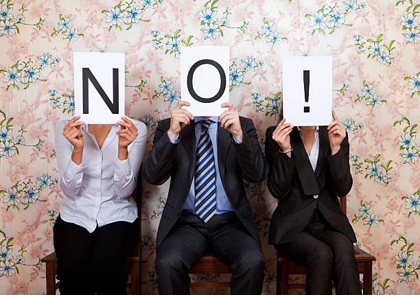 Three people holding the word NO! over their faces Judges holding up No sign rejection stock pictures, royalty-free photos & images