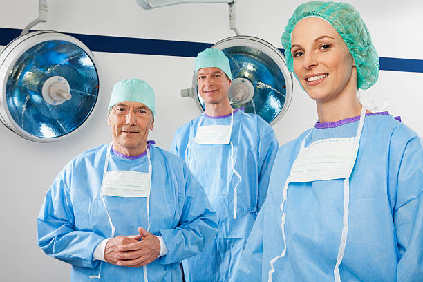 Three surgeons smiling stock photo