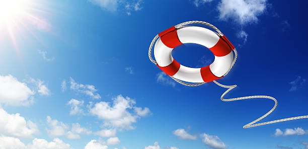 Throwing A Life Preserver In The Sky Lifebelt with sunlight and serene sky life belt stock pictures, royalty-free photos & images