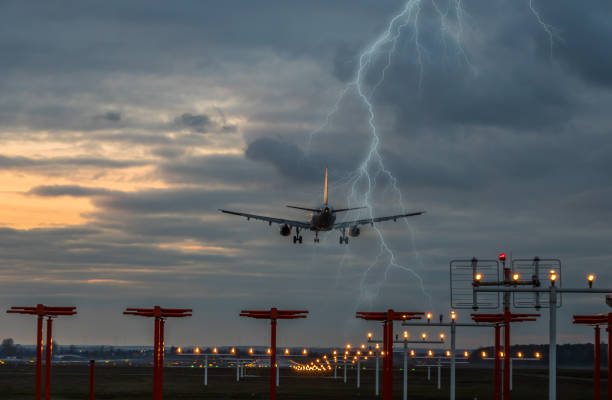 Thunderstorm on landing airplane at the airport stock photo