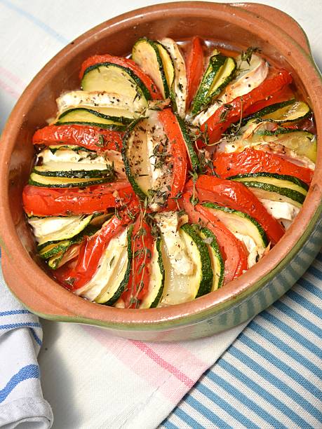Tian with zucchini, tomatoes and goat cheese stock photo