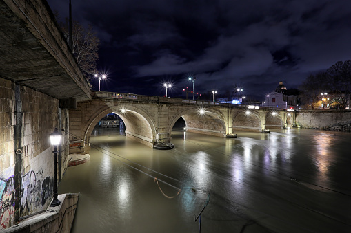 Tiber river in flood, Rome Italy. Night view